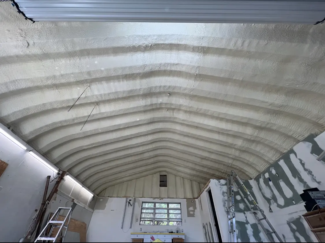 Spray polyurethane foam applied to the underside of a metal roof deck in Little Canada